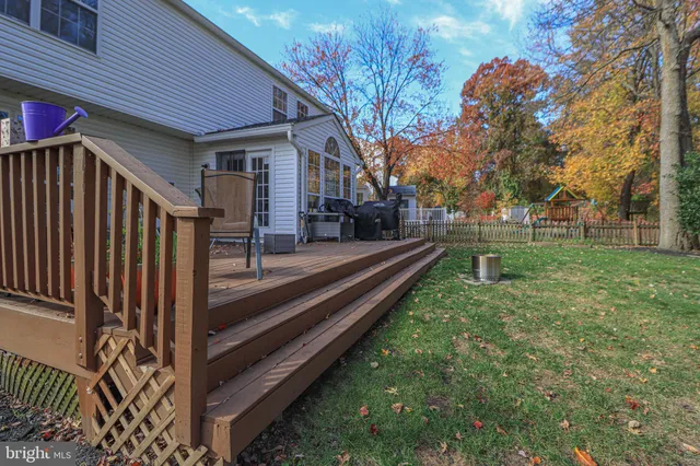 a view of a backyard with swimming pool
