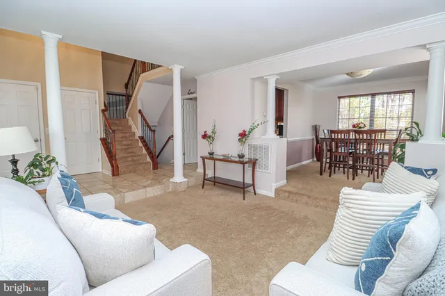 a view of a livingroom with wooden floor and a fireplace