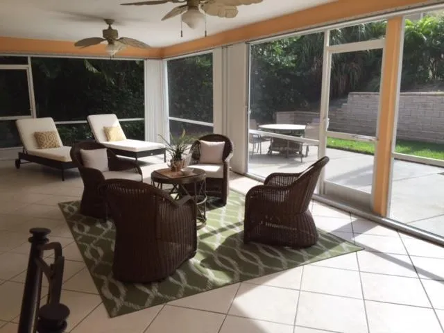 a building outdoor space with patio furniture and potted plants