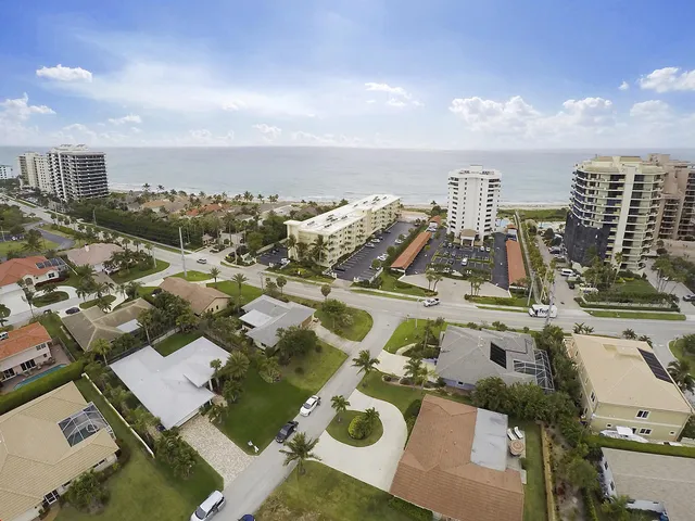 an aerial view of a city with yard and ocean view