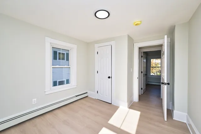 wooden floor in an empty room and a window