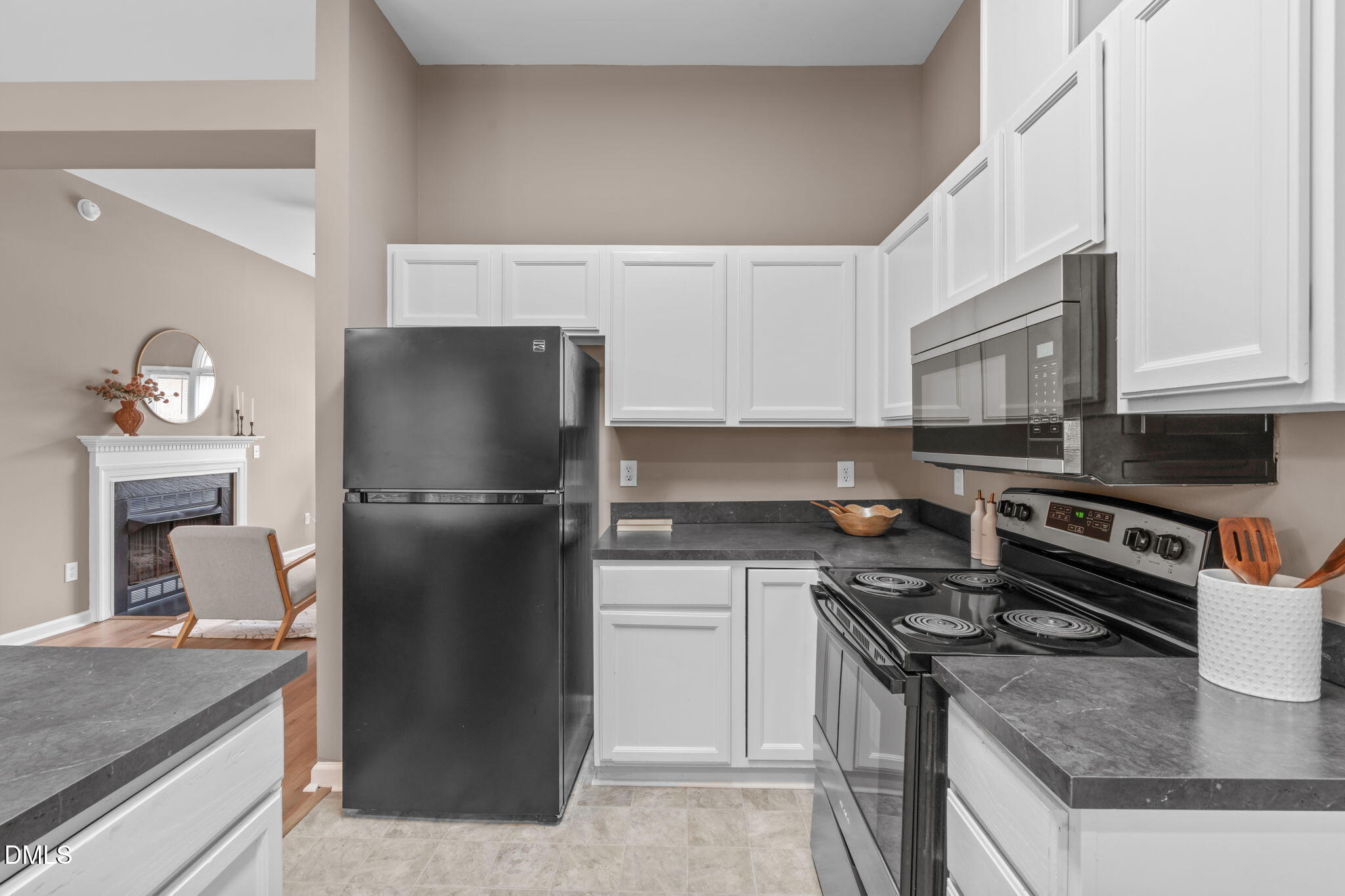 420 Johnson Street Garner, NC 27529 - Photo 19 of 43 a kitchen with a stove refrigerator and microwave
