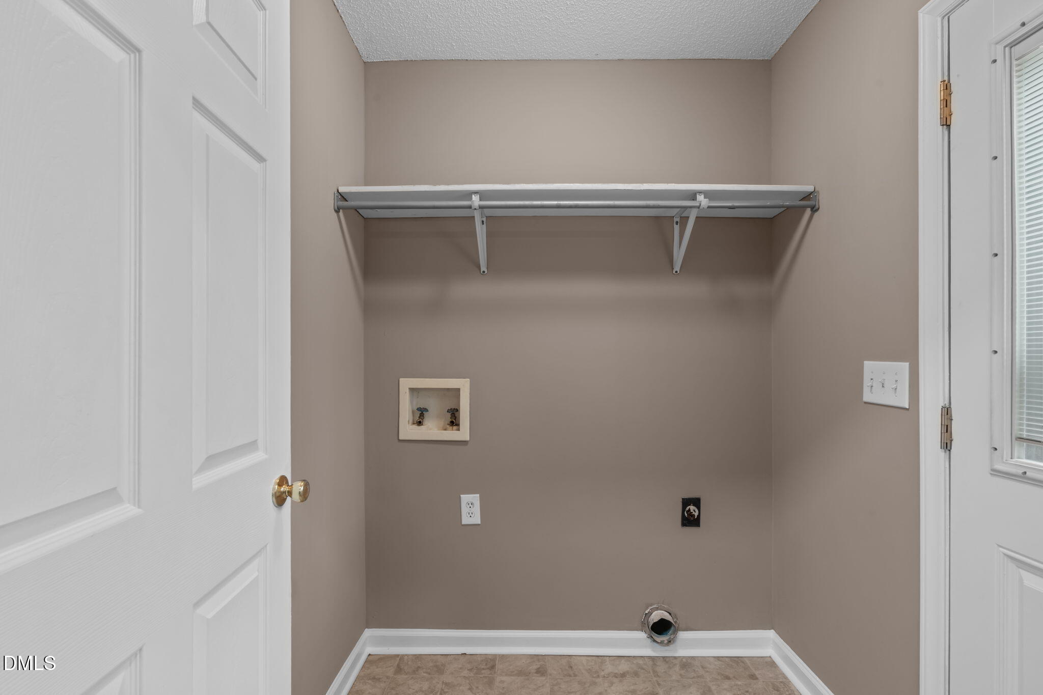 420 Johnson Street Garner, NC 27529 - Photo 20 of 43 a view of a room with racks on the wall