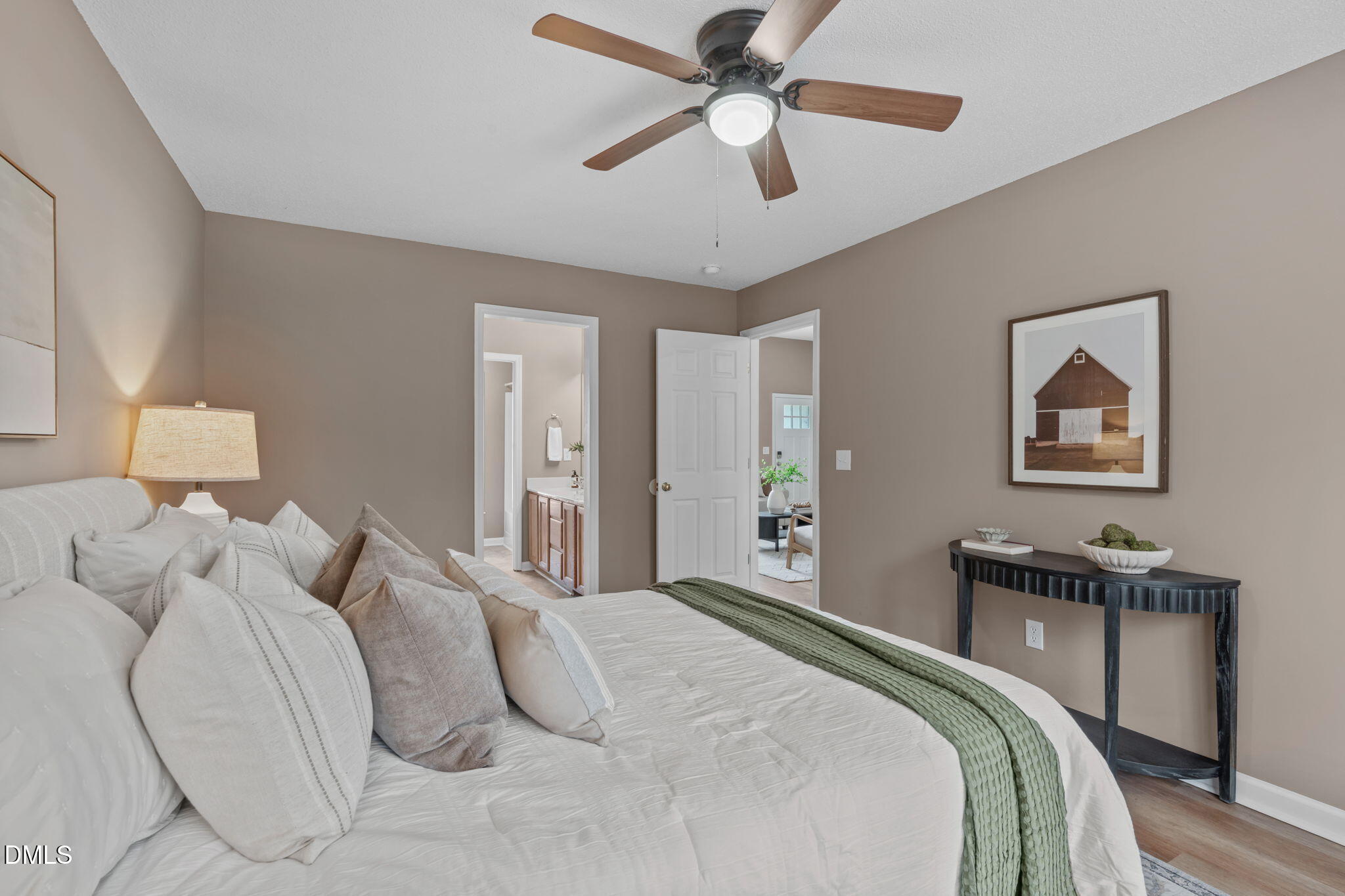 420 Johnson Street Garner, NC 27529 - Photo 23 of 43 a bedroom with a bed and a chandelier