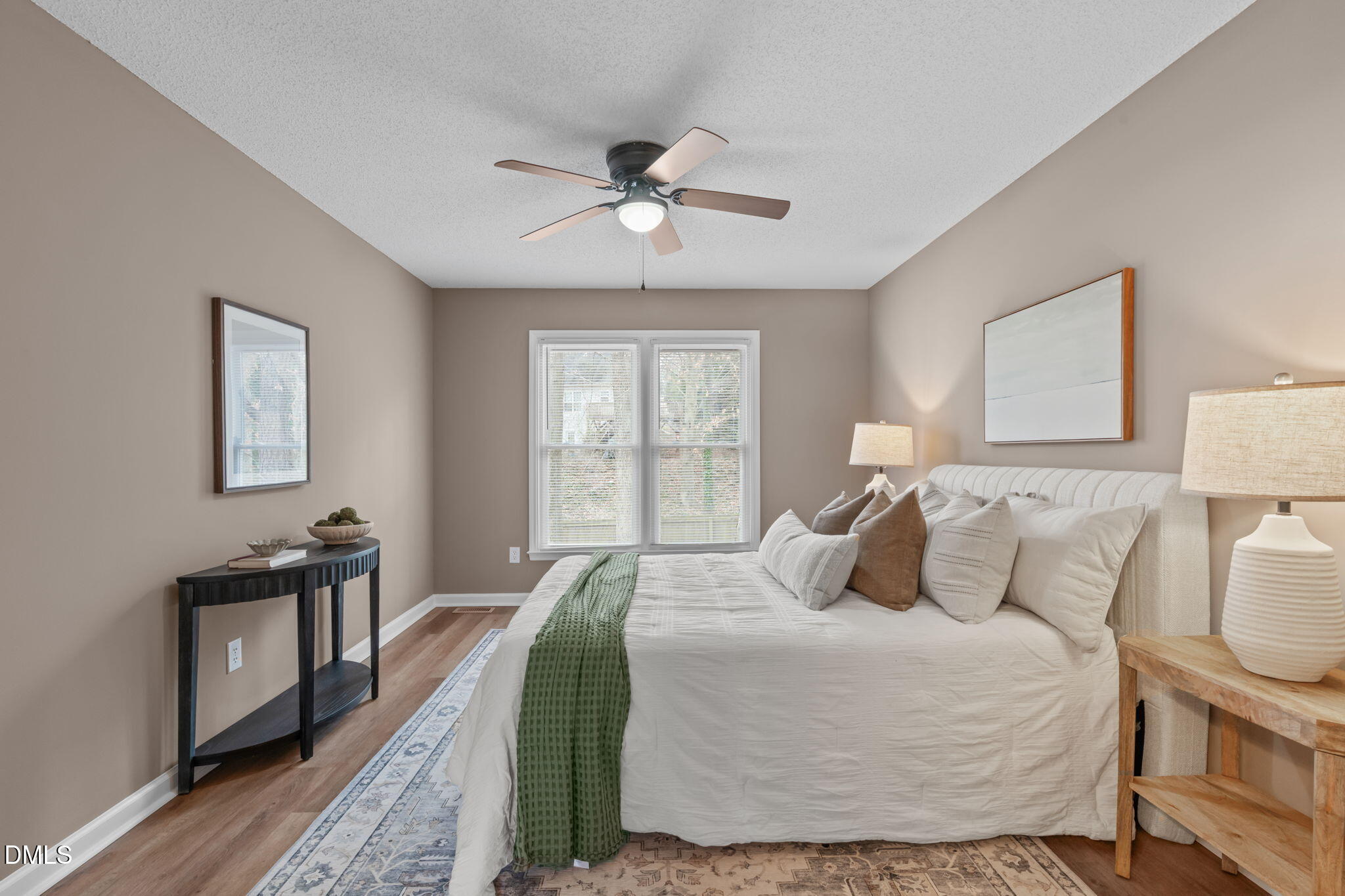 420 Johnson Street Garner, NC 27529 - Photo 24 of 43 a bedroom with a bed and wooden floor