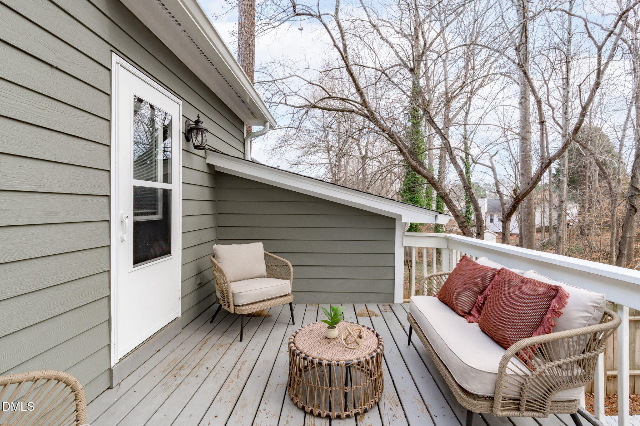 420 Johnson Street Garner, NC 27529 - Photo 34 of 43 a view of a patio with couches chairs and wooden floor