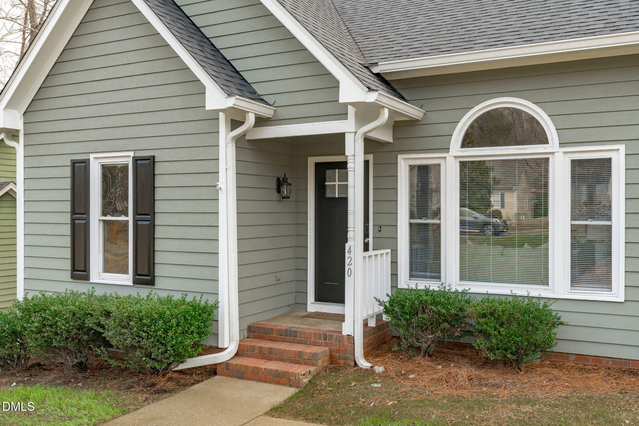420 Johnson Street Garner, NC 27529 - Photo 3 of 43 a front view of a house with garden