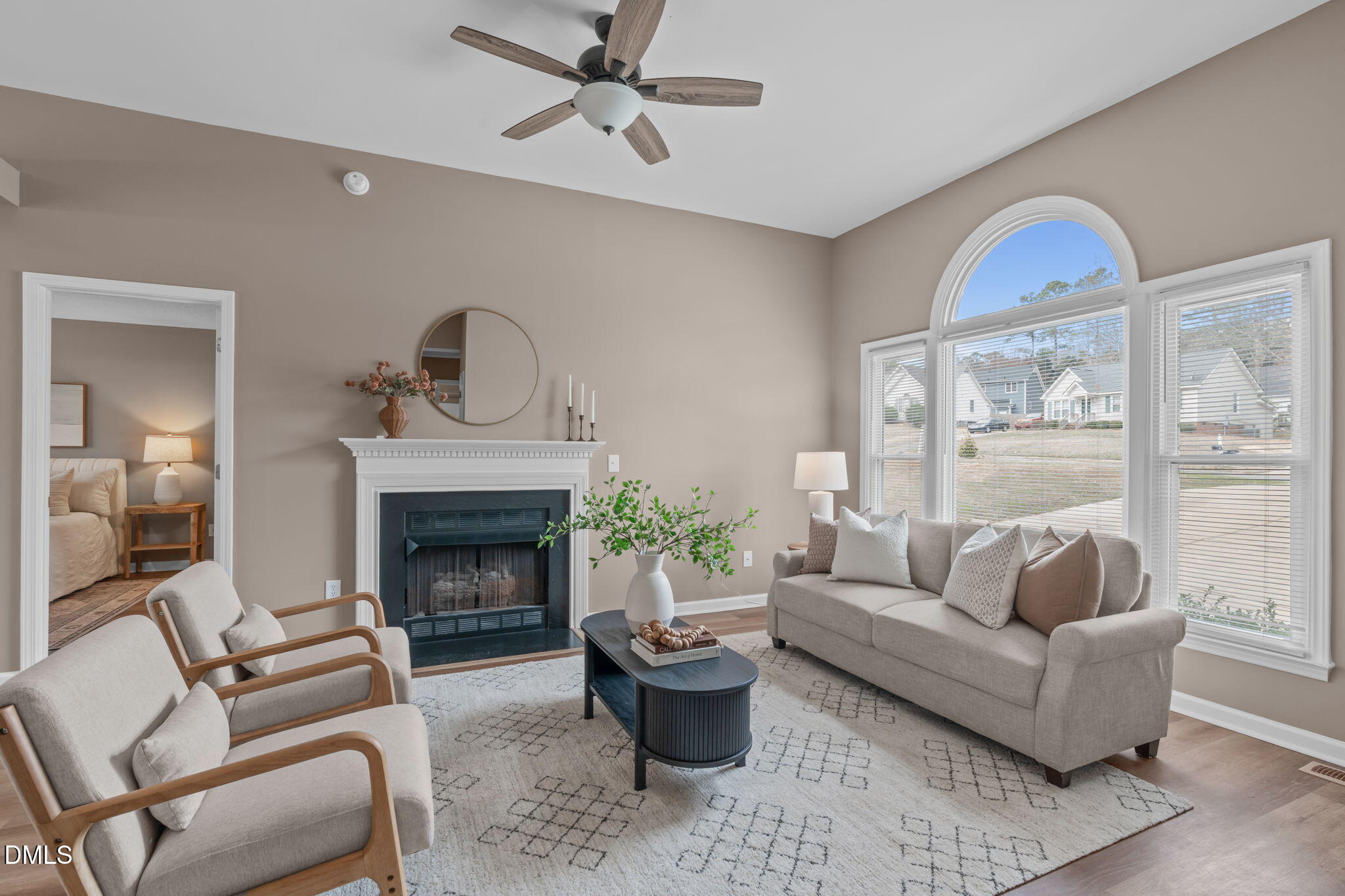 420 Johnson Street Garner, NC 27529 - Photo 7 of 43 a living room with furniture a fireplace and a large window