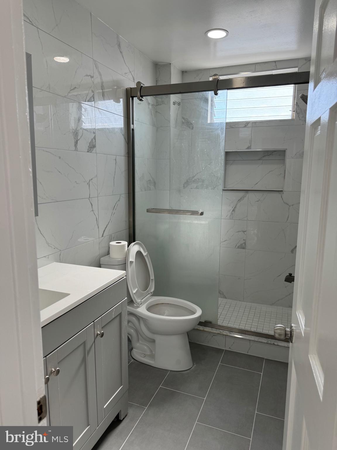 139 Rosemar Street Philadelphia, PA 19120 - Photo 11 of 19 a bathroom with a toilet sink and shower