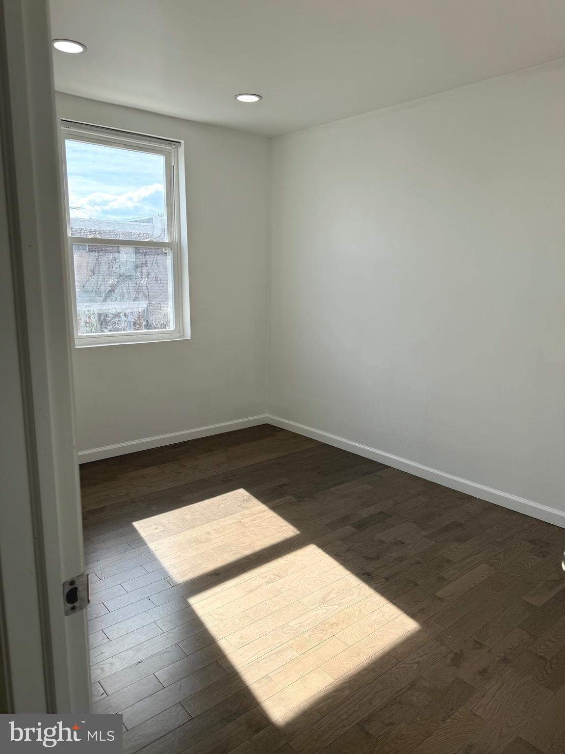 139 Rosemar Street Philadelphia, PA 19120 - Photo 13 of 19 an empty room with wooden floor