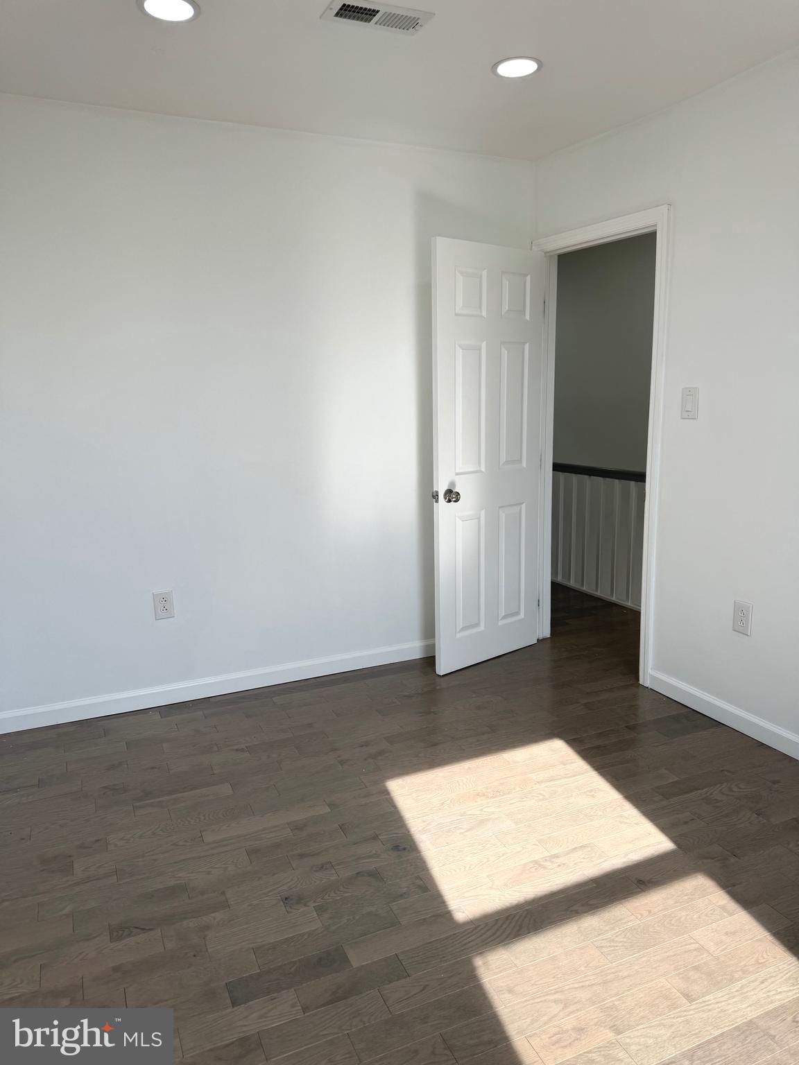 139 Rosemar Street Philadelphia, PA 19120 - Photo 10 of 19 an empty room with wooden floor and closet
