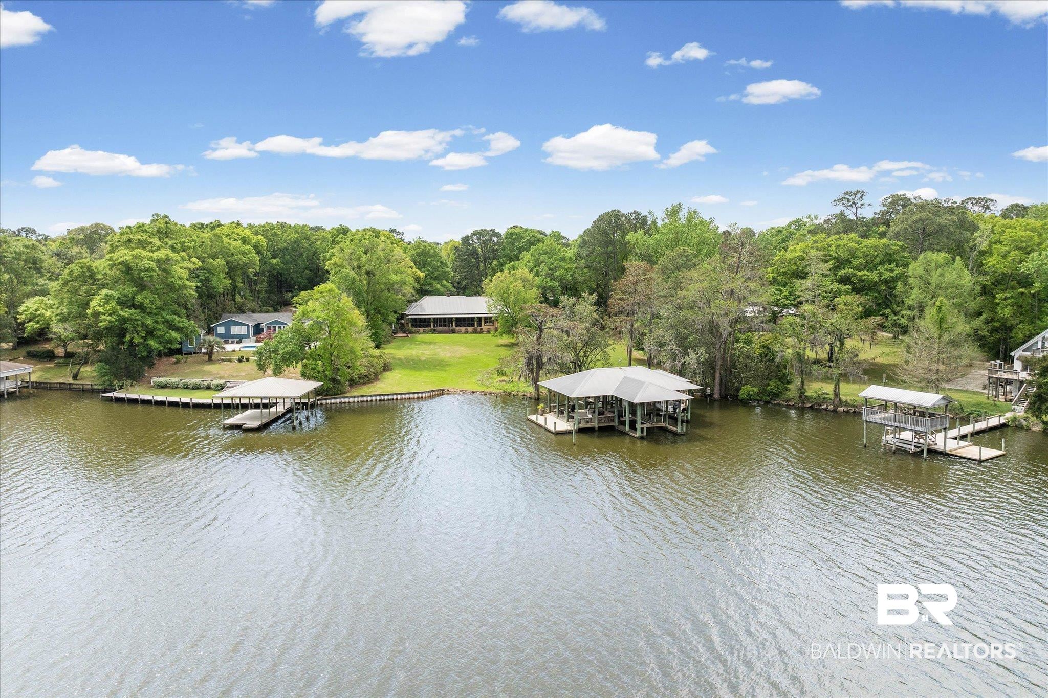 2300 Burgett Road Mobile, AL 36605 - Photo 2 of 40 Water view featuring a boat dock and boat lift