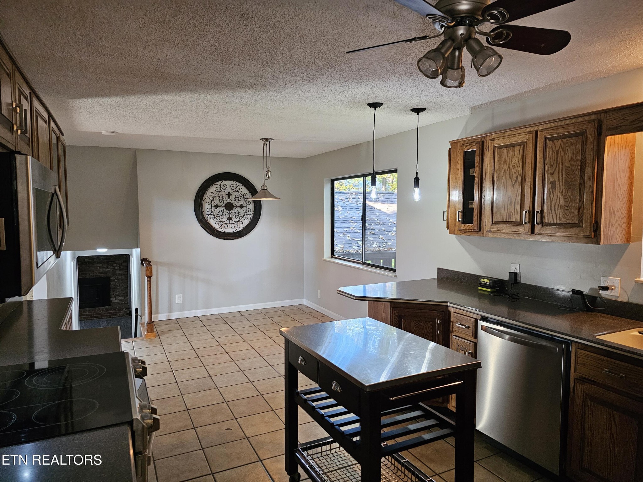 20 Clark Place Oak Ridge, TN 37830 - Photo 12 of 51 a kitchen with a table chairs and a stove top oven