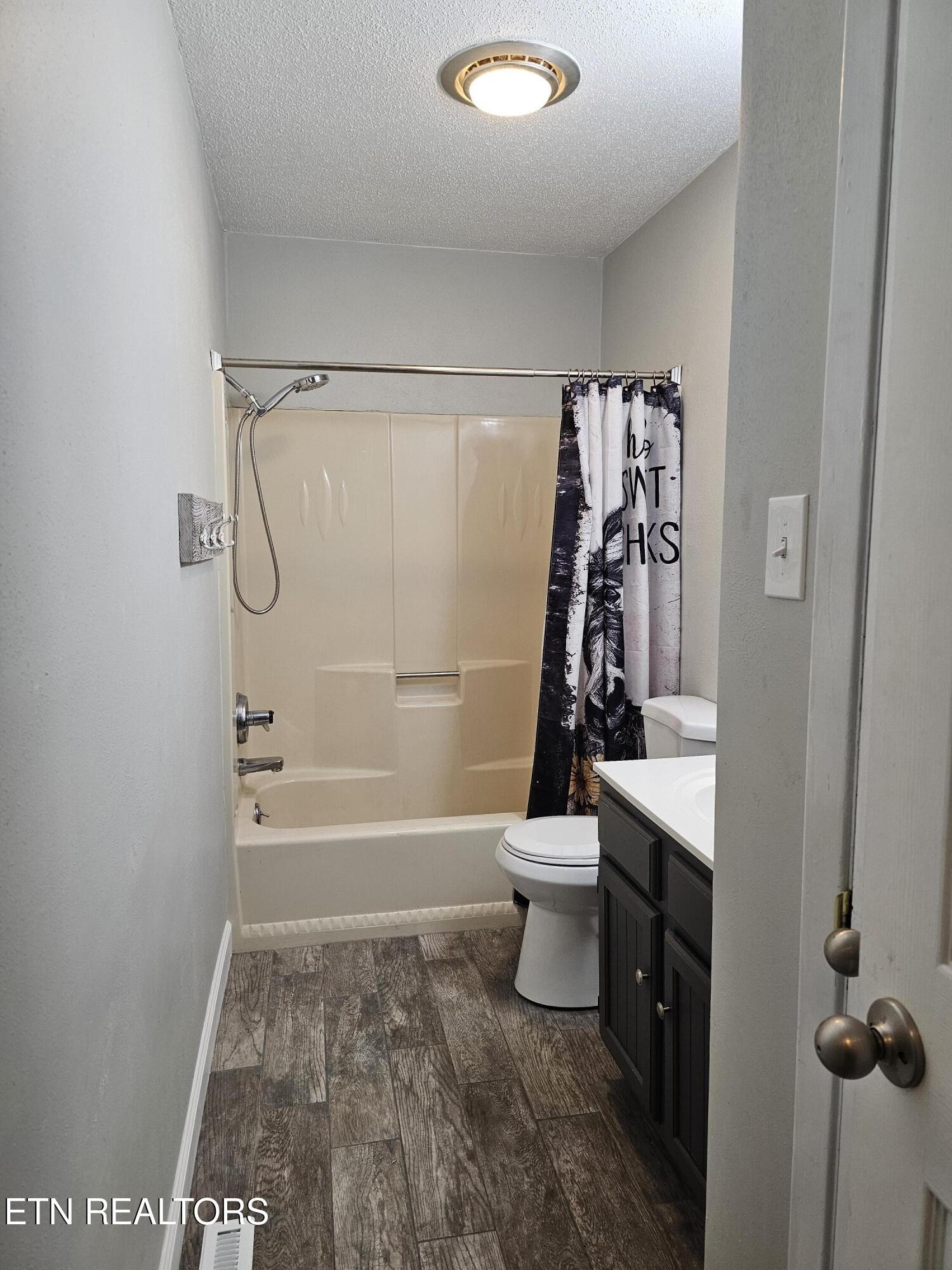 20 Clark Place Oak Ridge, TN 37830 - Photo 18 of 51 a bathroom with a shower a toilet and sink