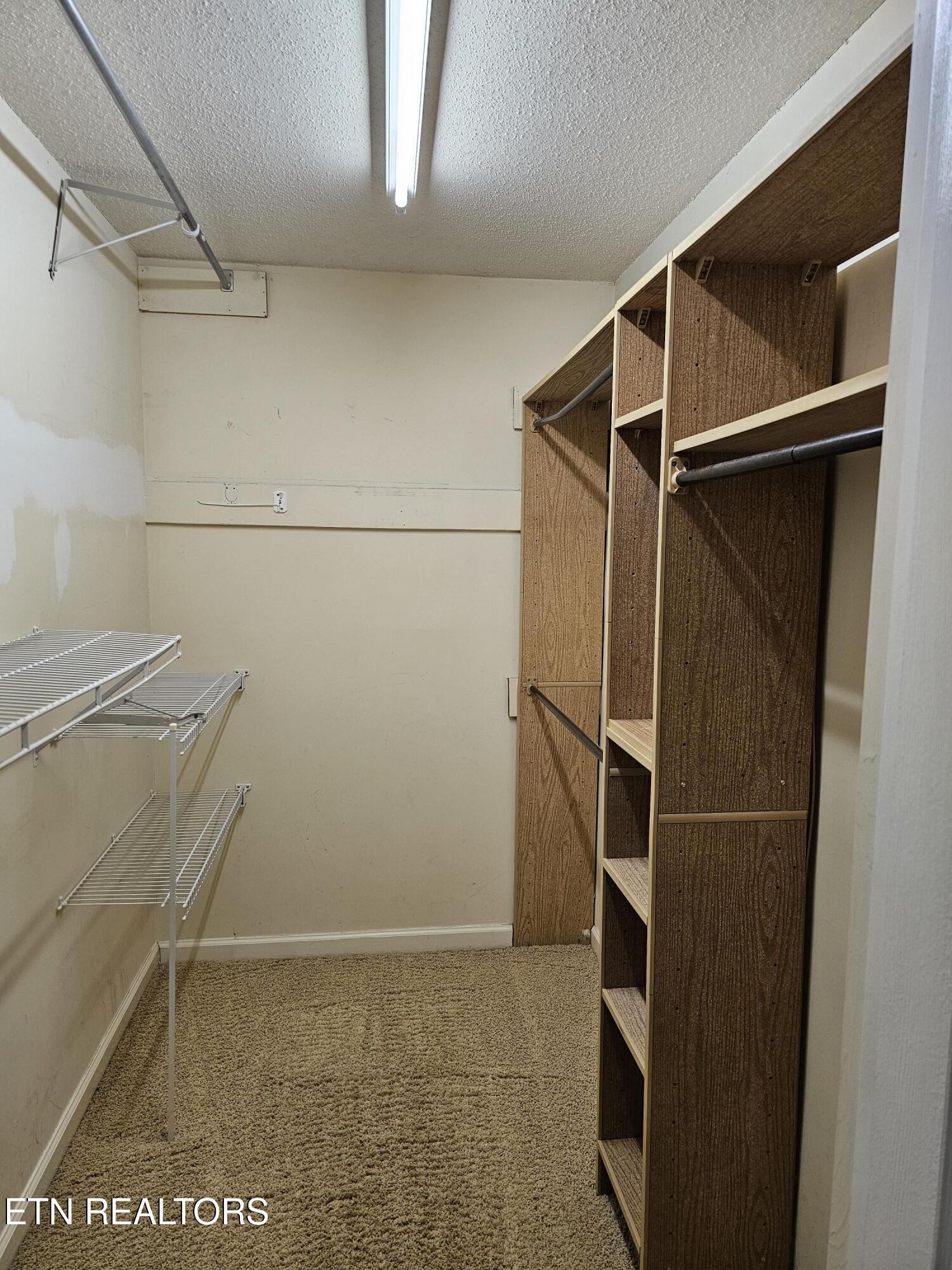 20 Clark Place Oak Ridge, TN 37830 - Photo 27 of 51 a view of walk in closet with clothes and shoes