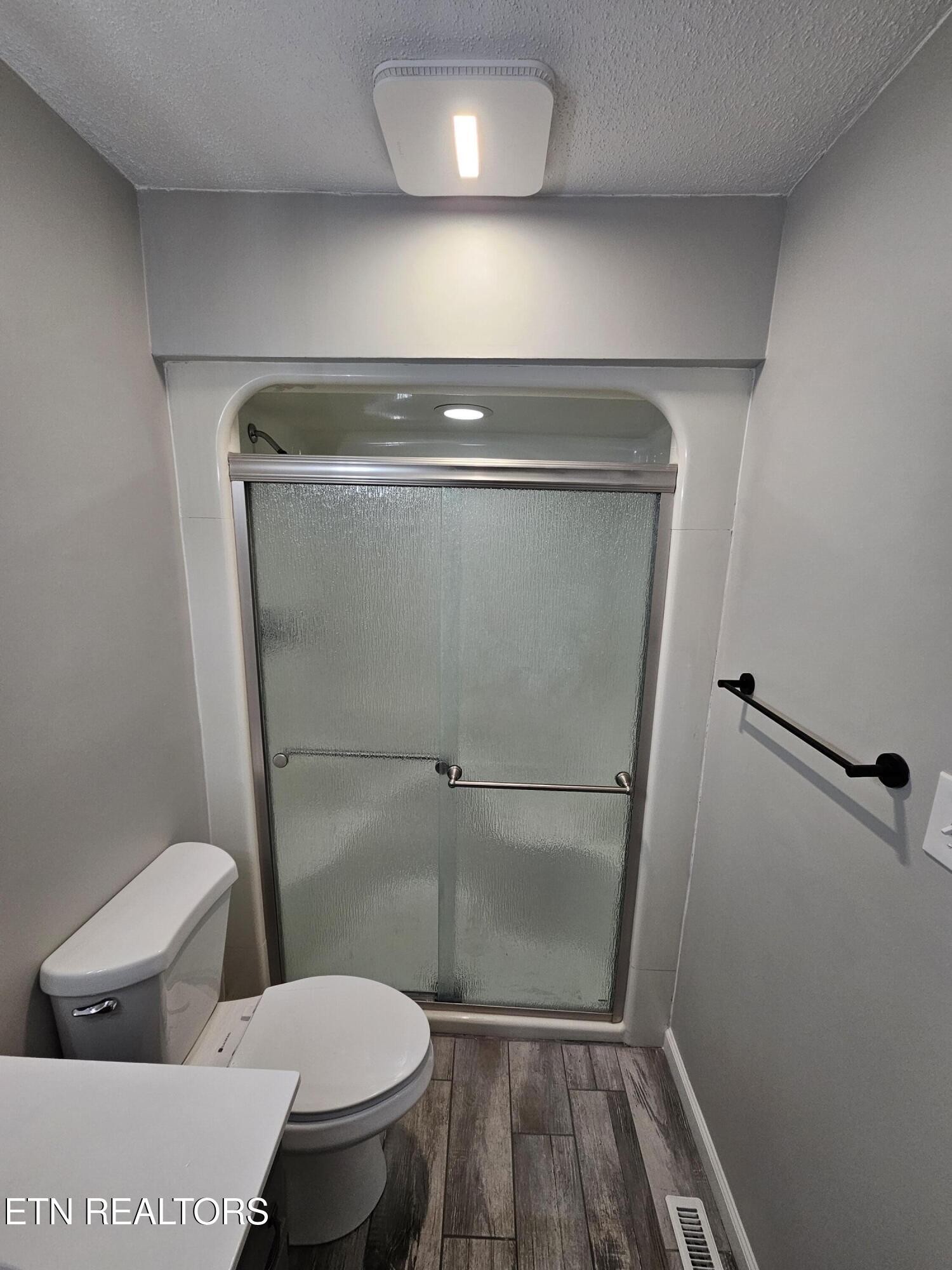 20 Clark Place Oak Ridge, TN 37830 - Photo 30 of 51 a bathroom with a toilet and a shower
