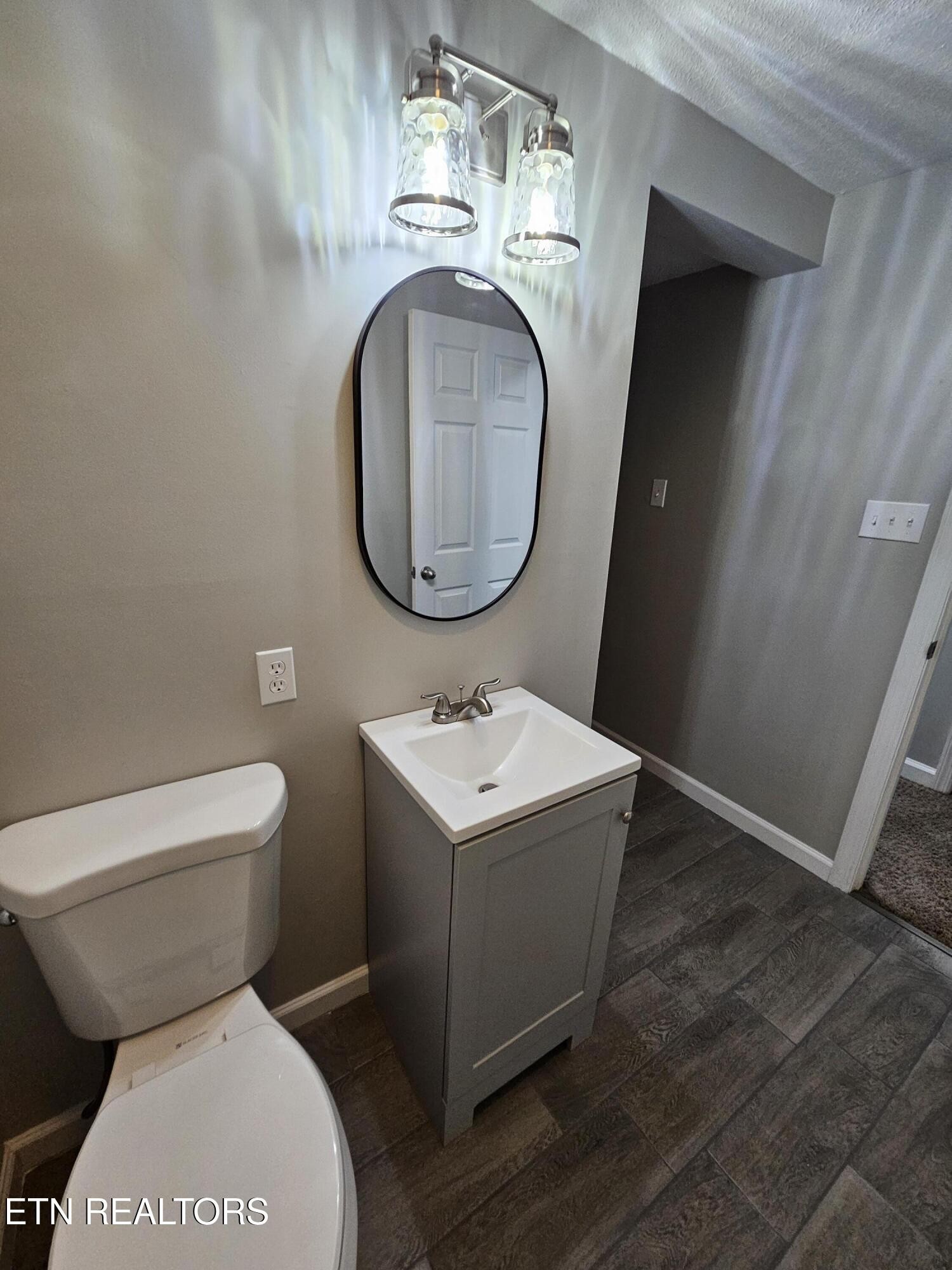 20 Clark Place Oak Ridge, TN 37830 - Photo 35 of 51 a bathroom with a toilet sink and mirror