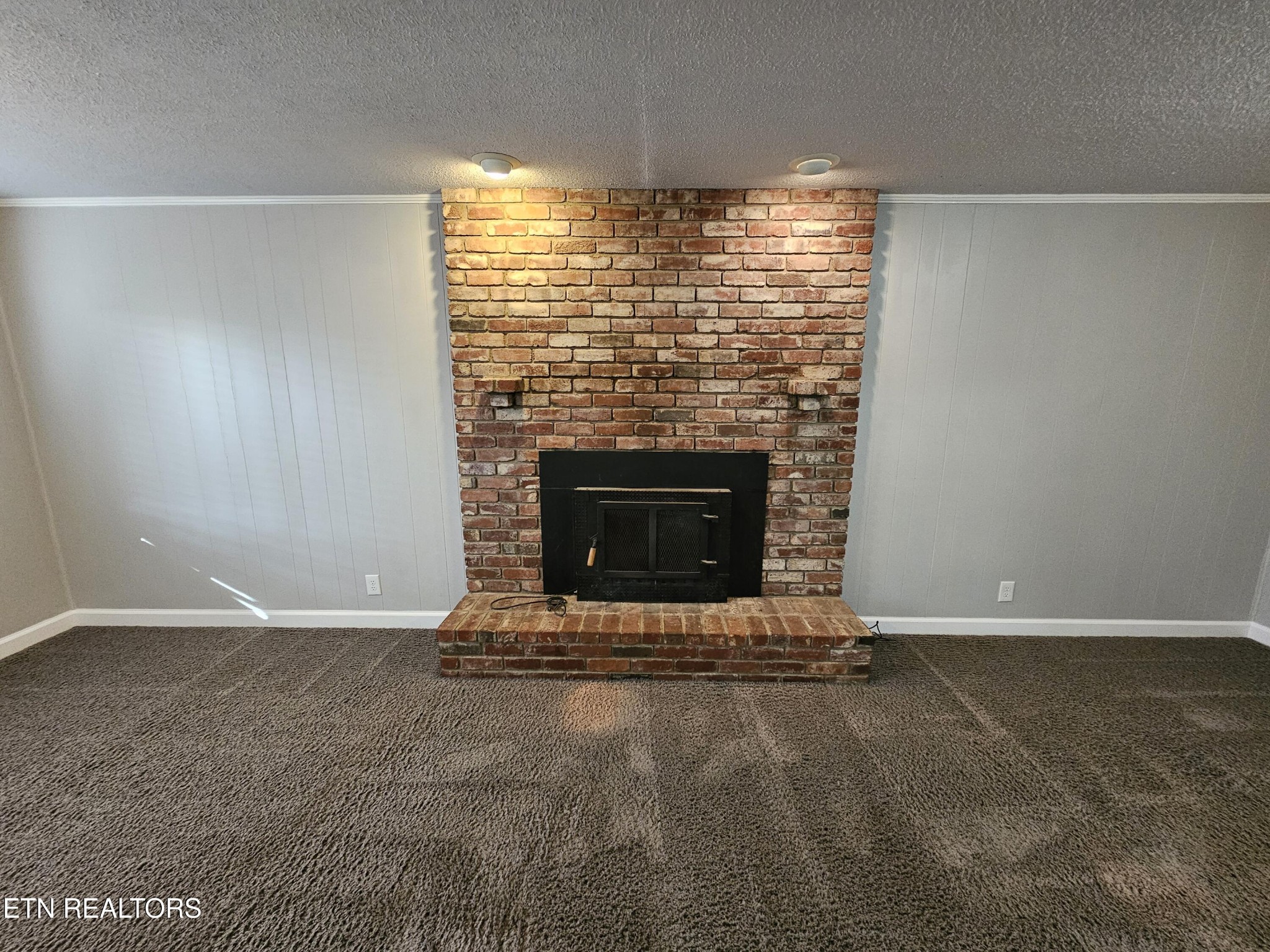 20 Clark Place Oak Ridge, TN 37830 - Photo 37 of 51 an empty room with a fireplace