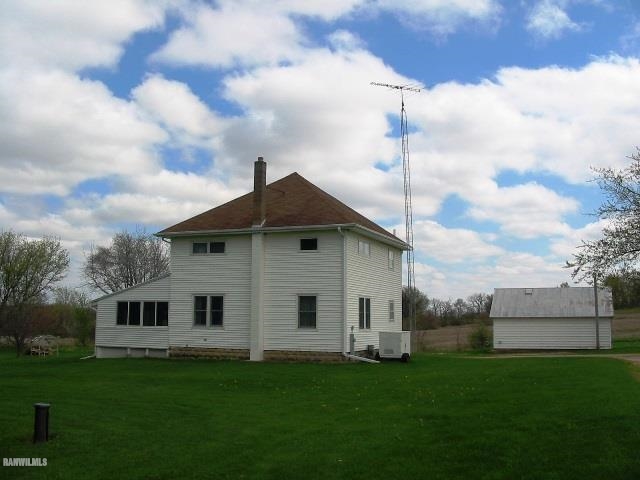 9815 West Raders Road Pearl City, IL 61062 - Photo 3 of 15 a view of a yard in front of a house
