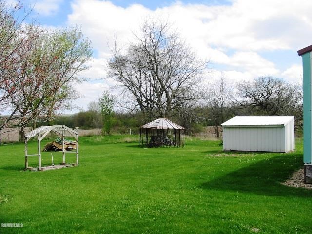 9815 West Raders Road Pearl City, IL 61062 - Photo 6 of 15 a view of a house with backyard
