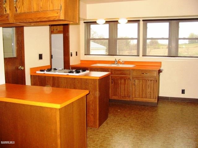 9815 West Raders Road Pearl City, IL 61062 - Photo 10 of 15 a view of a kitchen with a sink and large window