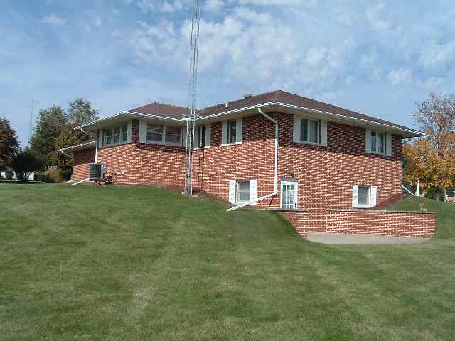 3623 W Route Freeport, IL 61032 - Photo 3 of 5 a front view of a house with a garden