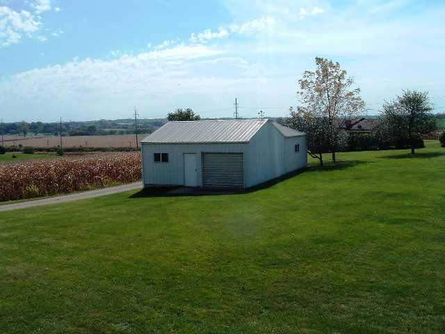 3623 W Route Freeport, IL 61032 - Photo 5 of 5 a view of a house with a garden and a yard