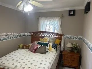a bedroom with a bed and a mirror