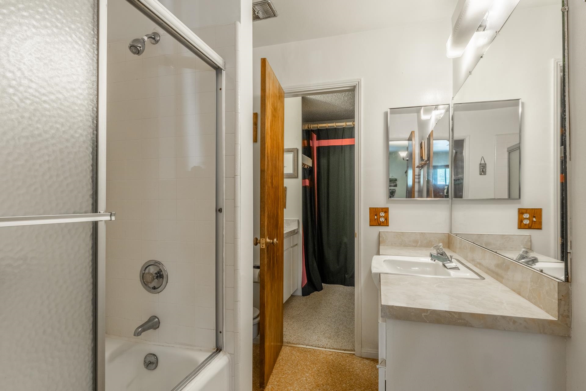50 Hidden Valley Road, Unit 17 Mammoth Lakes, CA 93546 - Photo 29 of 40 Bathroom featuring a tub/shower combination with sliding glass doors, a vanity with an integrated si