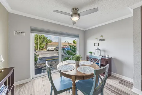 a view of a dining room with furniture and wooden floor