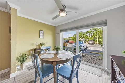 a view of a dining room with furniture wooden floor and kitchen