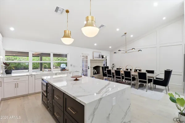 a kitchen with a table and chairs in it
