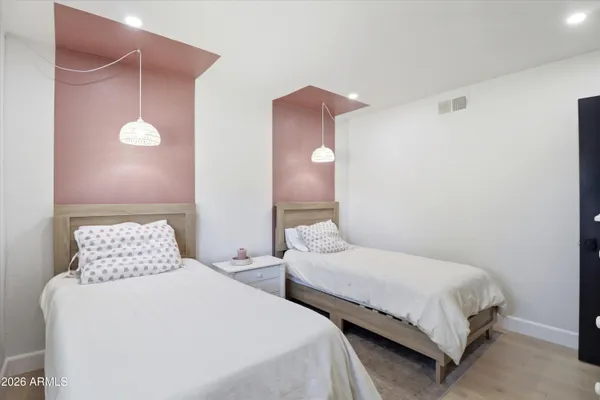 a bedroom with a bed and window