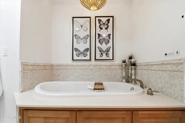 a bathroom with a sink vanity and a mirror