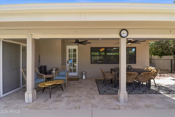 a view of a swimming pool with an outdoor seating