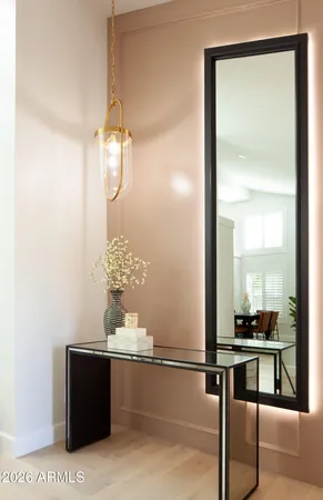 a room with table and mirror