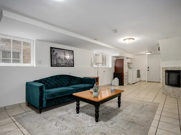a living room with furniture and a fireplace