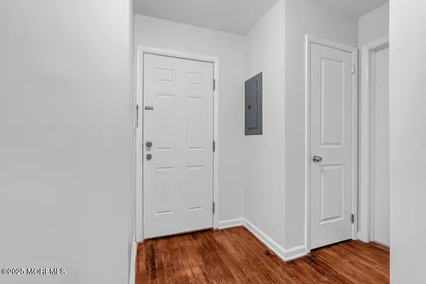 a view of a livingroom with wooden floor