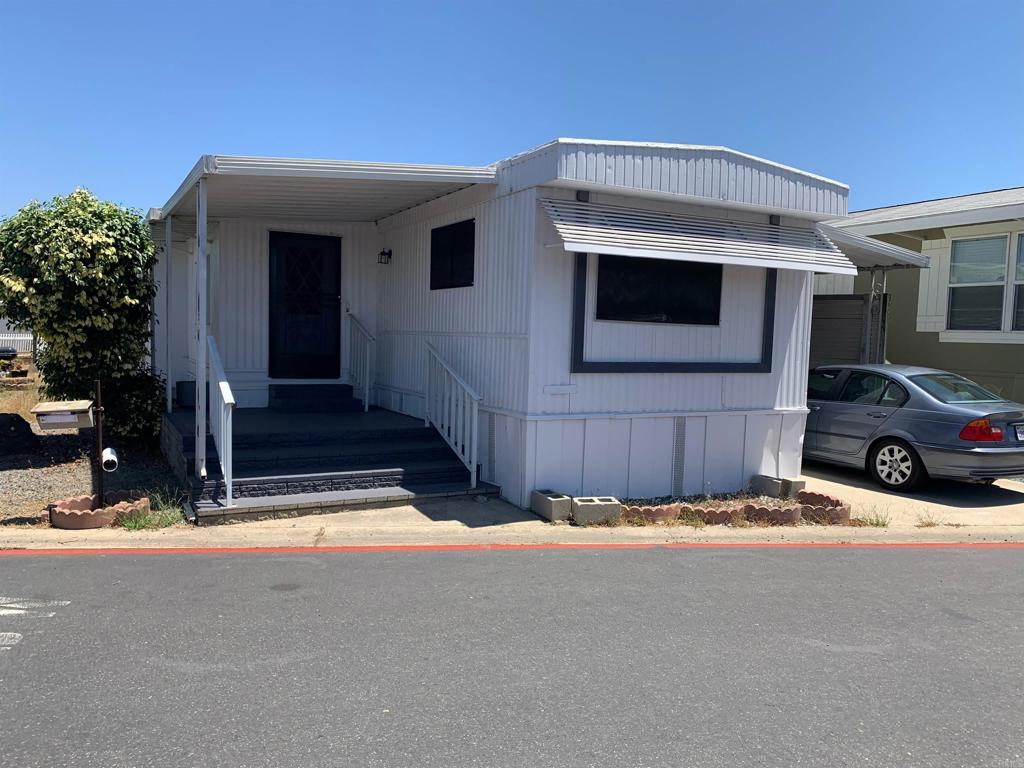a view of car parked in front of house