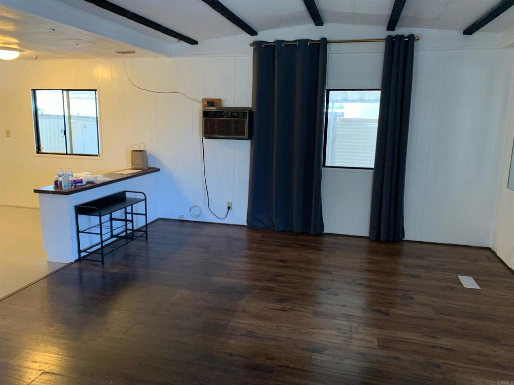 7 Lynn Lane Oceanside, CA 92058 - Photo 6 of 9 a view of a hardwood floor in a hall with wooden floor