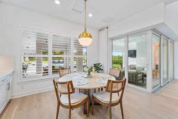 a bathroom with a toilet a sink a mirror a shower and vanity