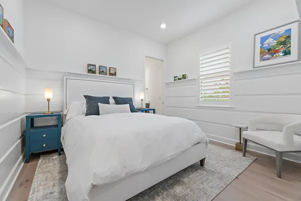 a bedroom with a bed and a table in it