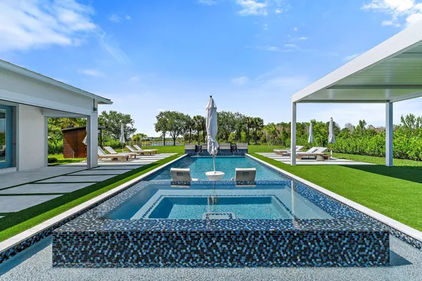 a aerial view of a house with swimming pool