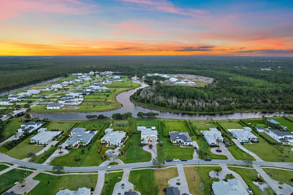 a bathroom with a toilet a sink a shower and mirror