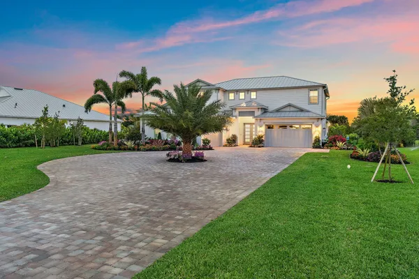 a living room with furniture a rug and a chandelier