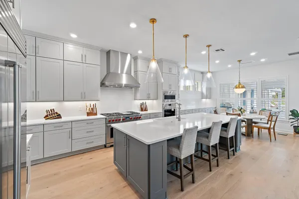 a bathroom with a tub sink toilet and a mirror