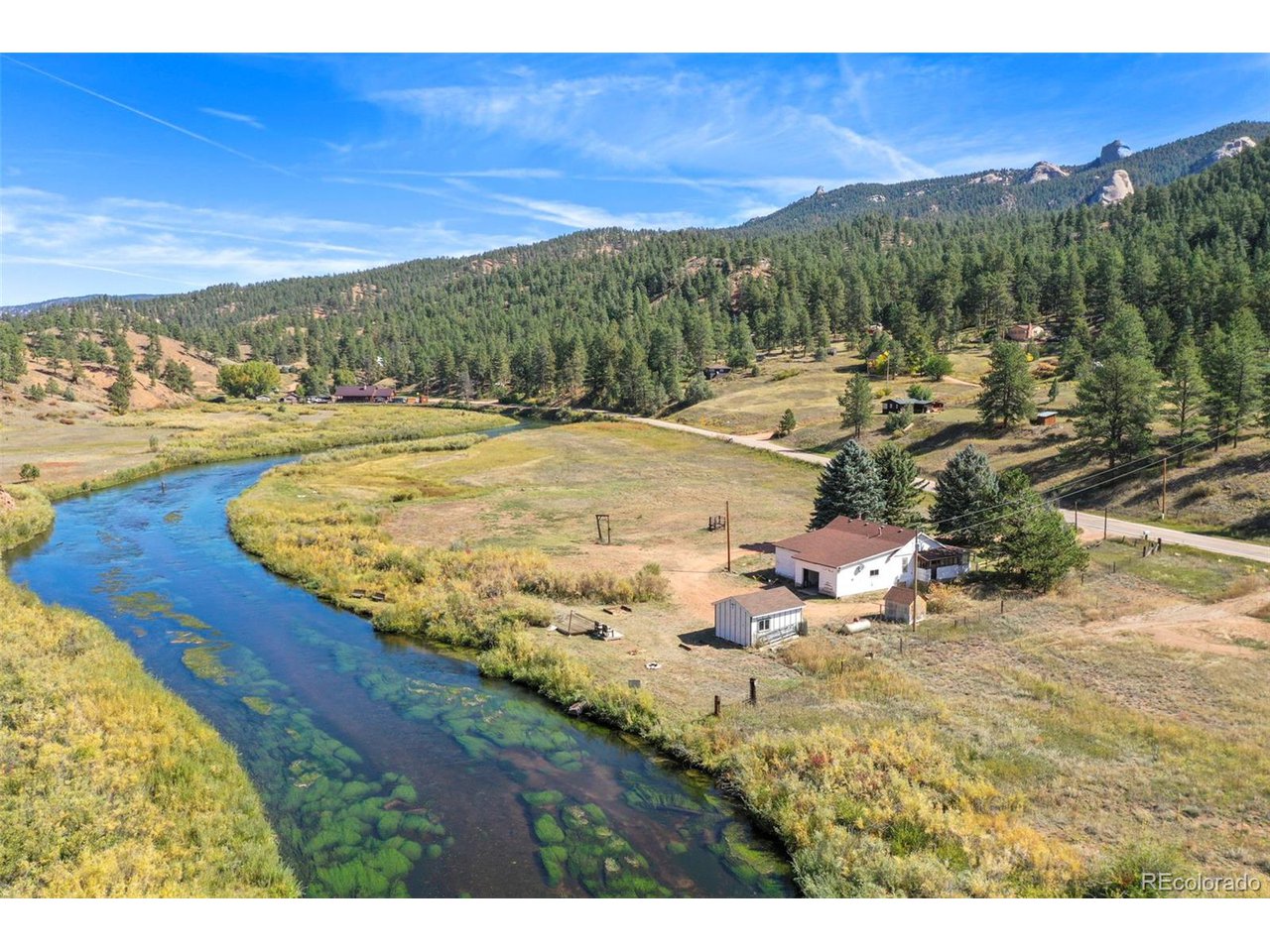 a view of a yard with an ocean view