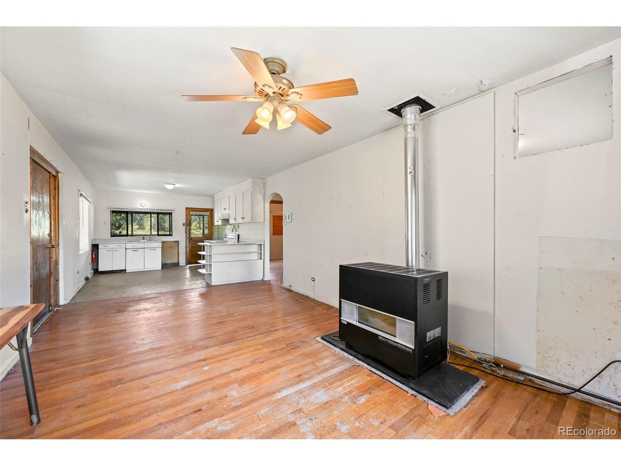 2677 South Platte River Road Sedalia, CO 80135 - Photo 13 of 42 a living room with furniture and a wooden floor