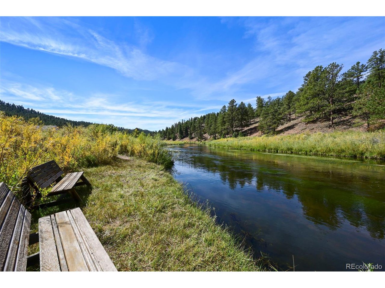 2677 South Platte River Road Sedalia, CO 80135 - Photo 2 of 42 a view of a lake with a outdoor space
