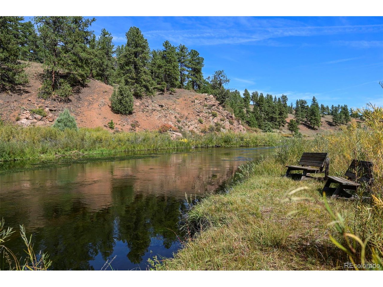 2677 South Platte River Road Sedalia, CO 80135 - Photo 23 of 42 a view of a lake with outdoor space